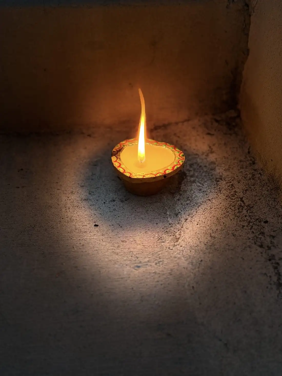 A single diya lamp burning gently
