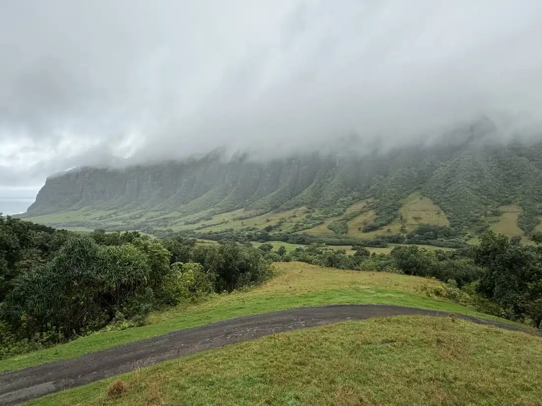 Cloudy mountain hillside with a winding path