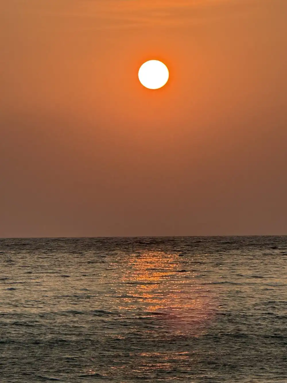 Sunset over calm water