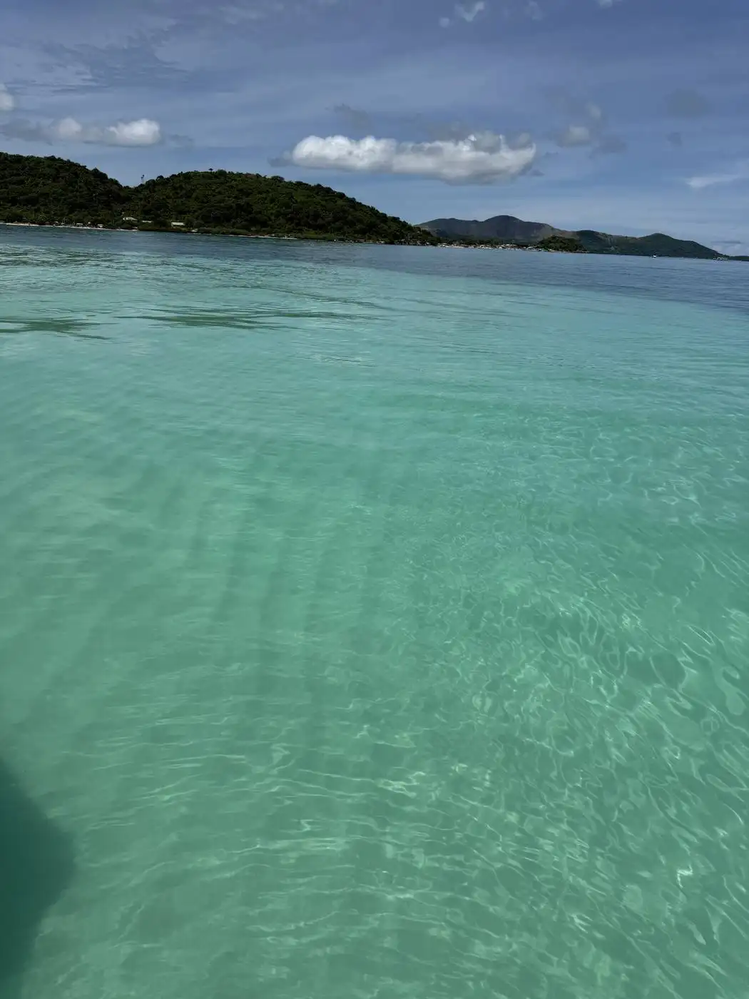 Tropical shoreline with rocks and calm water